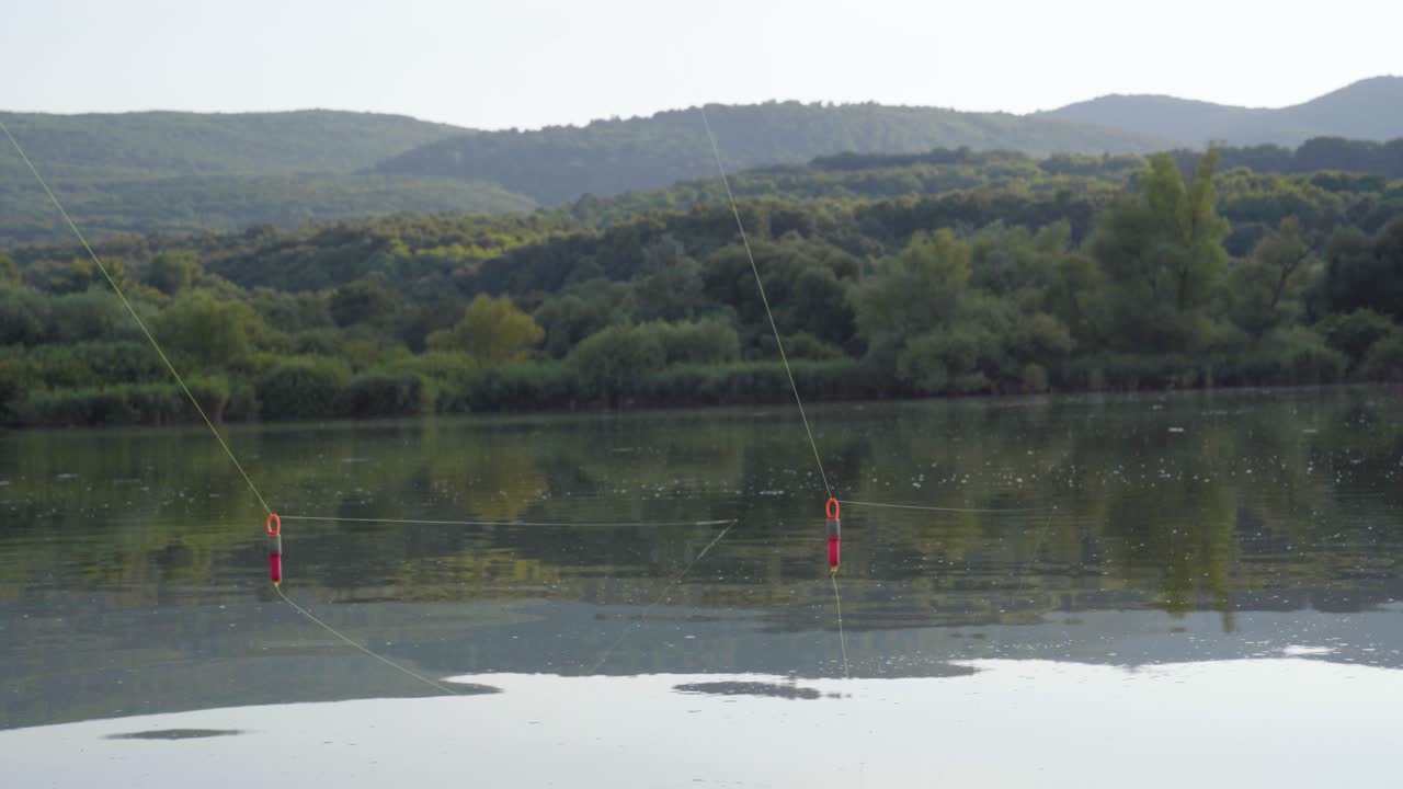Fishing lines suspended over lake near Varbo, Hungary