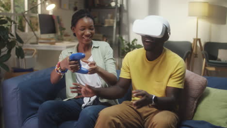 couple playing virtual reality game at home