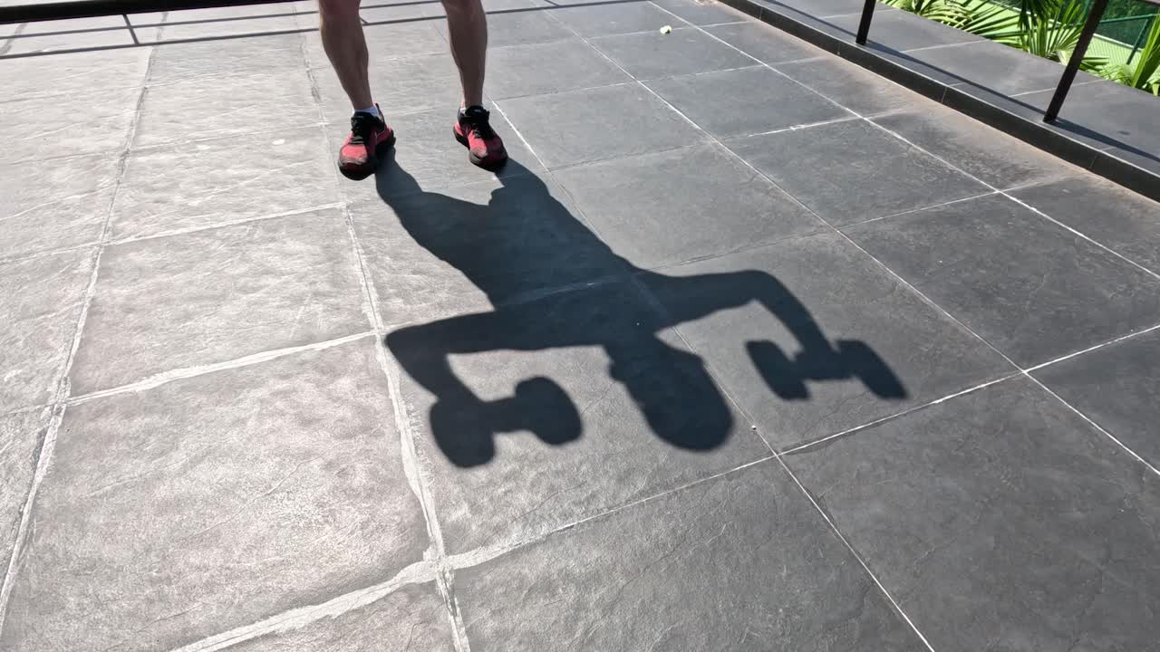 Person casting playful shadow movements.