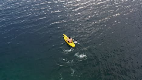 man kayaking on the beautiful san pablo island, hinunangan, southern leyte, philippines