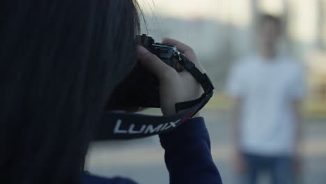 woman taking a picture outdoors