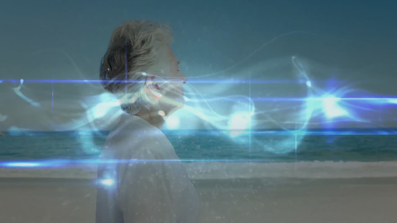 Demo tecnologica che mostra una donna anziana sulla riva che segue un'energia blu che emerge da sinistra attraverso il busto.