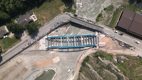 bridge rigging on a construction site in tende, south of france, during the day, aerial view