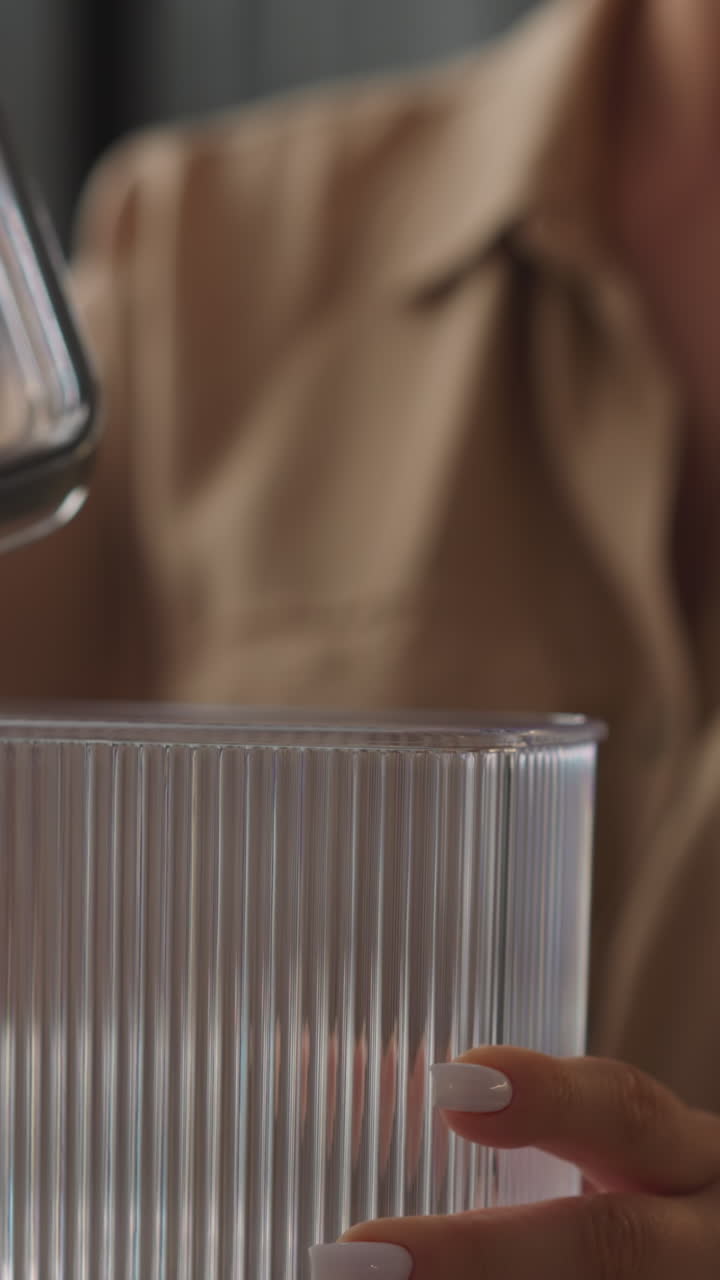 Young lady removes lid from transparent plastic food container. Woman looks at new utensil carefully turning in hands. Female examines purchase for kitchen closeup