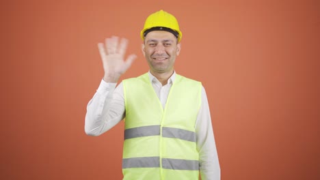 Engineer-waving-at-camera.