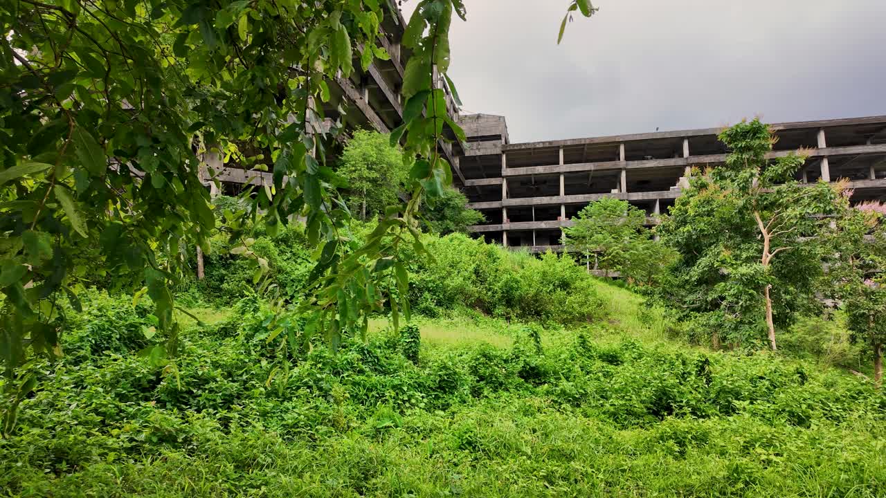 explore the mysterious ghost building in Ranong, Thailand abandoned, eerie, and full of stories. see nature reclaim the structure, and feel the spine-chilling atmosphere of this forgotten place