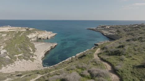 aerial shot revealing kalanka bay on a beautiful day in malta