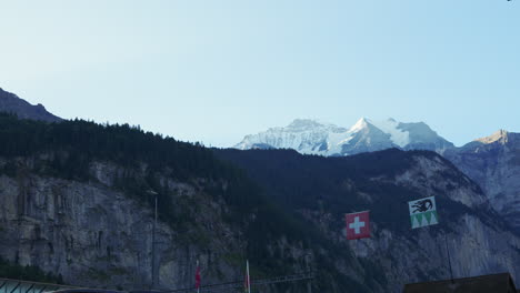 view from lauterbrunnen valley in swiss alps on mountain peaks in snow