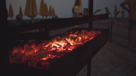 bbq grill at the beach - evening - slow motion