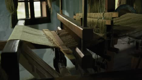 antique wooden loom and weaving process