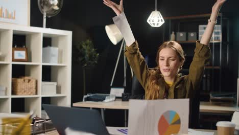 satisfied hipster girl finishing project indoors. businesswoman throwing papers.