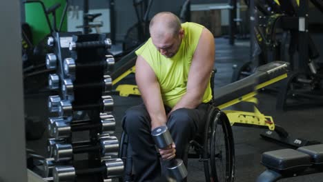 man with disabilities training in the gym of rehabilitation center