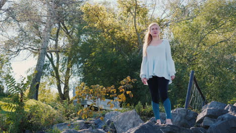 woman on rocks looks into distance