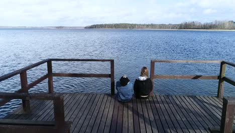 best friends sitting on the bridge