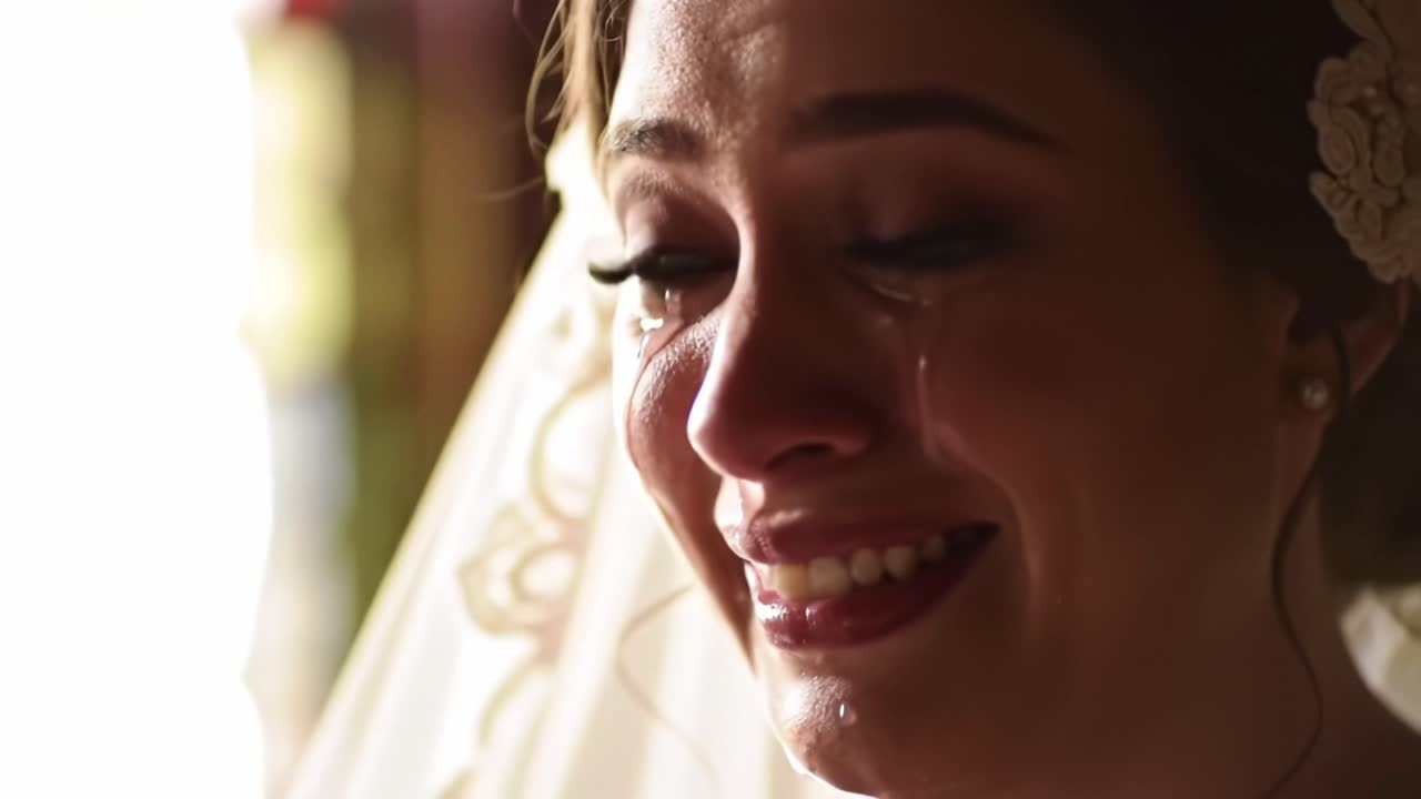 Emotional bride experiences heartfelt moment at wedding ceremony with tears of joy
