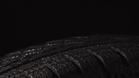 wet shiny tire in the dark