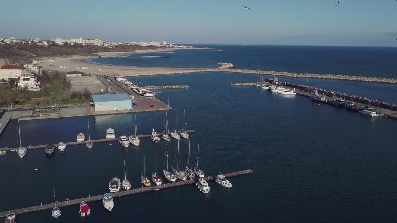 Aerial View of a Marina with Boats and Yachts on a Sunny Day