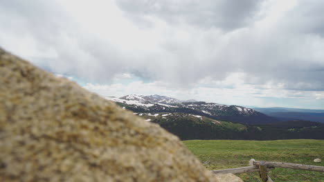 Peek-behind-a-rock-to-see-mountain