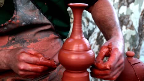 medieval potter using potters wheel and hands crafting earthenworks clay molds porcelains ceramics producing cooking pots, storage containers decorative objects guild member cutting craft ocupation