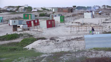 good establishing shot of the vast rural townships of south africa with tin huts slums poverty