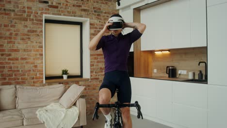 man using vr headset for virtual cycling exercise at home