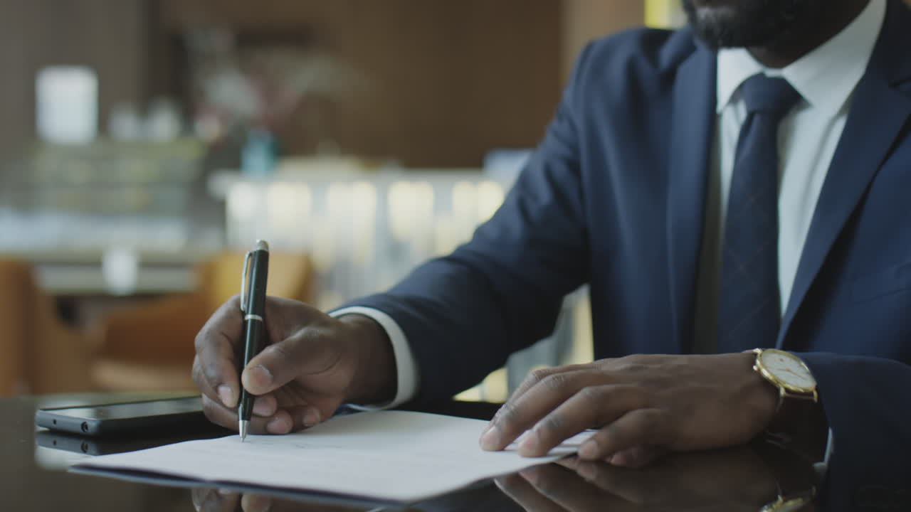 Business Partners Shaking Hands after Signing Contract