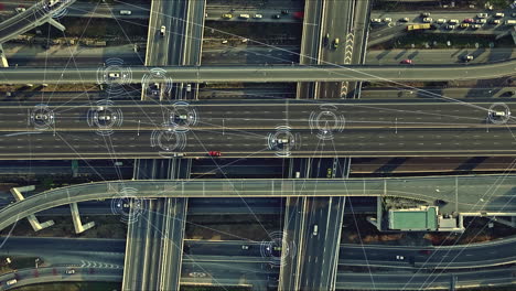 aerial view from above of traffic on the elevated expressway with futuristic autonomous, driverless cars using artificial intelligence computer network and satellite gps for navigation