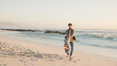 Father,-spinning-and-son-at-beach-for-fun