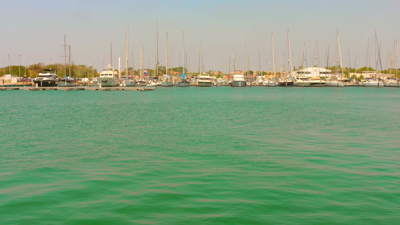 Serene marina view in Cap d'Agde, France with calm water under clear sky
