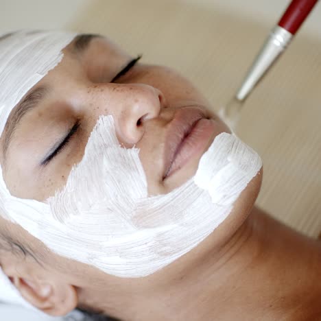Cosmetician-Applying-Facial-Mask