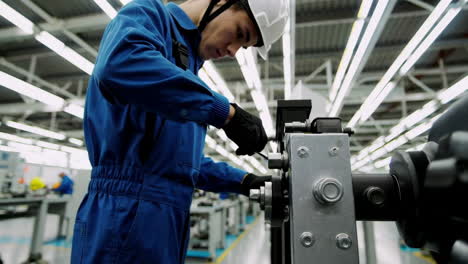 factory worker performing maintenance