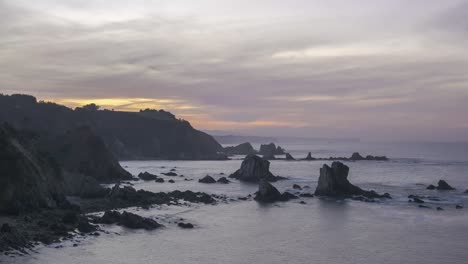 Cliffs-and-sea-against-sundown-sky