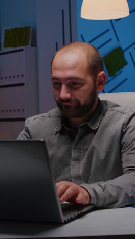 vertical video exhausted sleppy businessman yawning while working at management project deadline