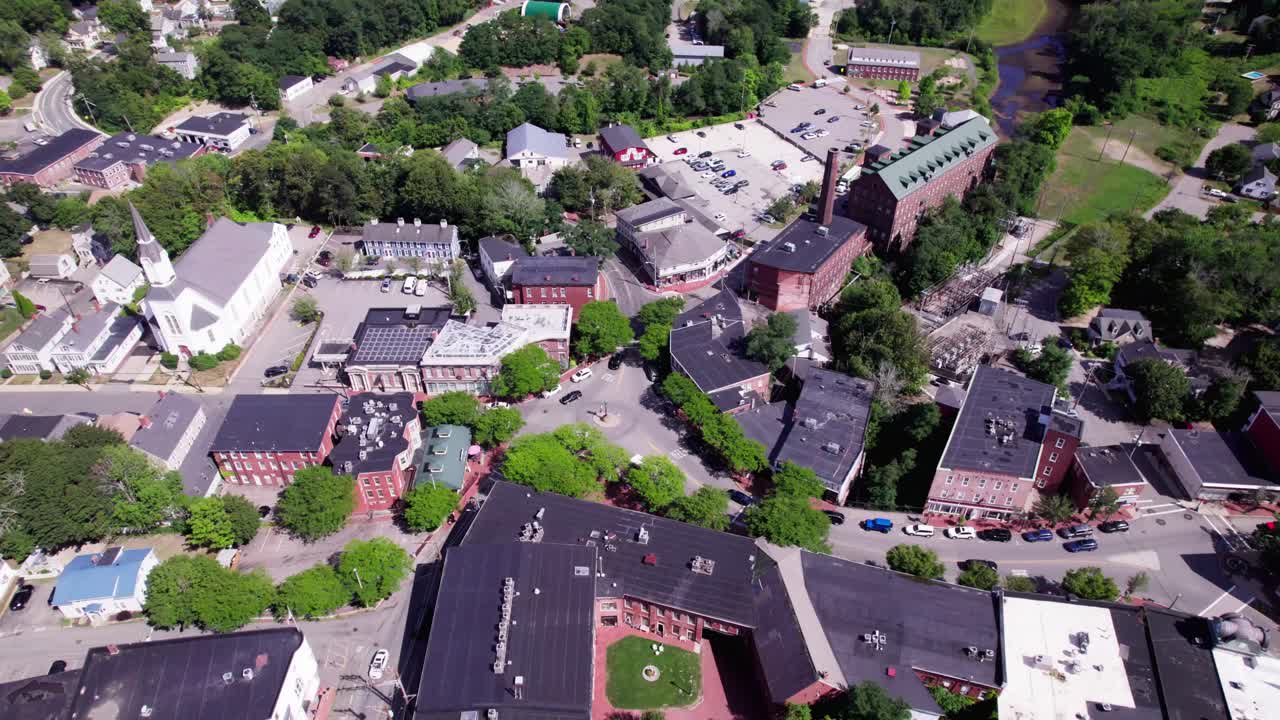 Fly past the historic Amesbury, Massachusetts town center traffic rotary