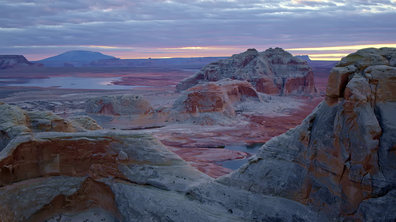 The camera flies low over Glen Canyon, accentuating the depth and texture of its fascinating eroded formations.