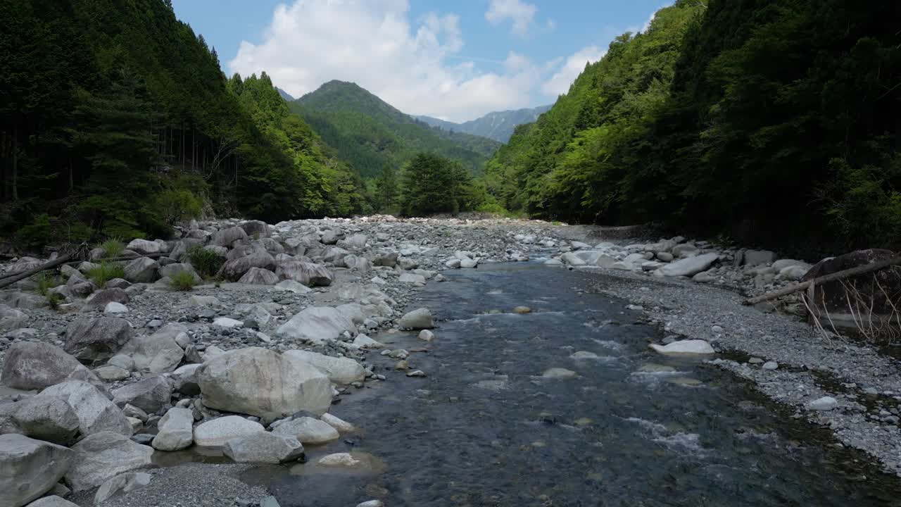 Stunning riverbed drone flight in natural forest