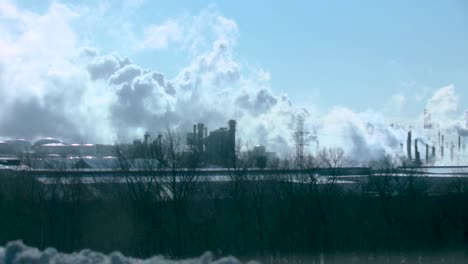 A slow horizontal pan of a huge industrial complex seen from a distance