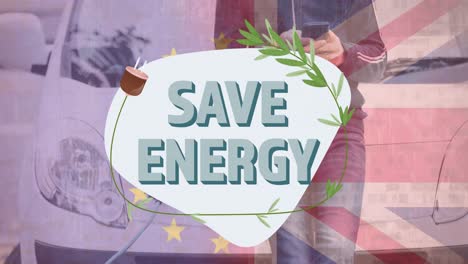 save energy text over flag of great britain and man charging electric car