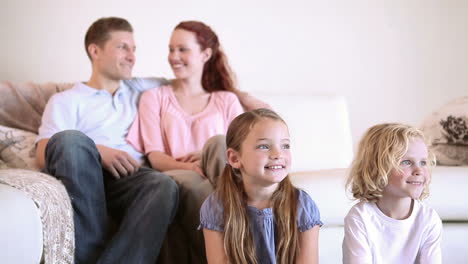 peaceful family watching the television