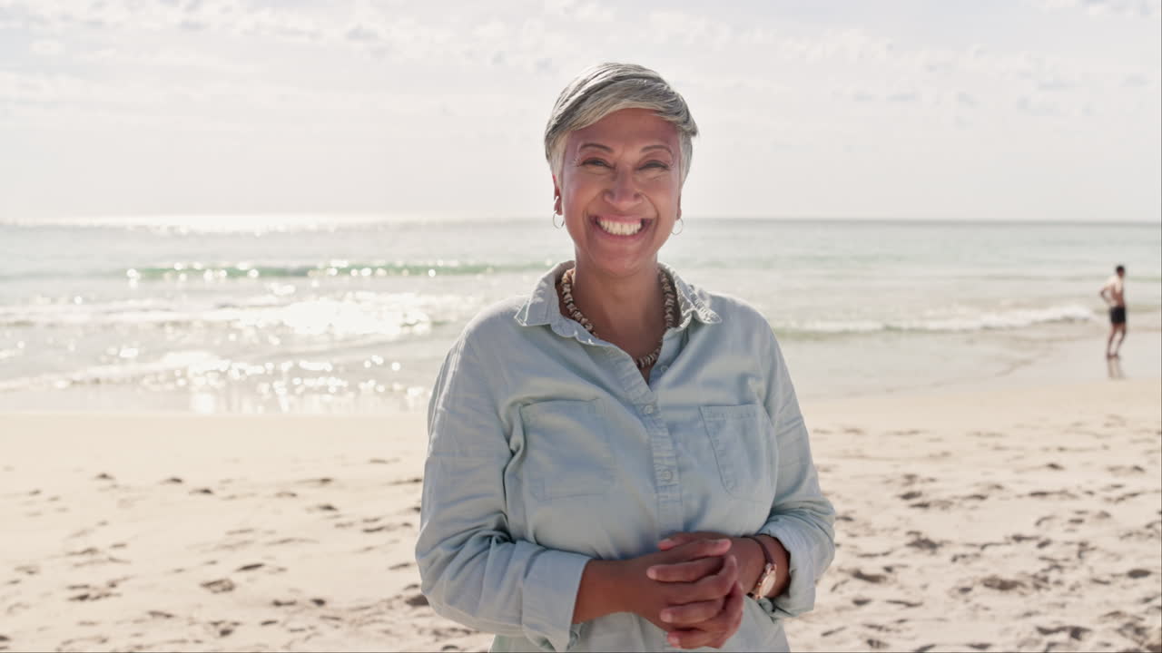 Face, relax and elderly woman at a beach