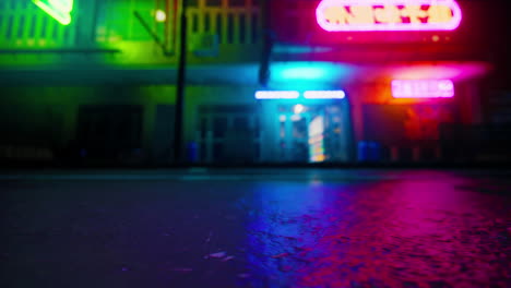 neon lights reflecting on a wet street at night