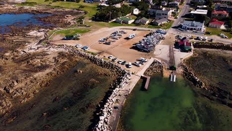 Aerial-pullback-reveals-harbor-where-shark-cage-diving-boats-depart