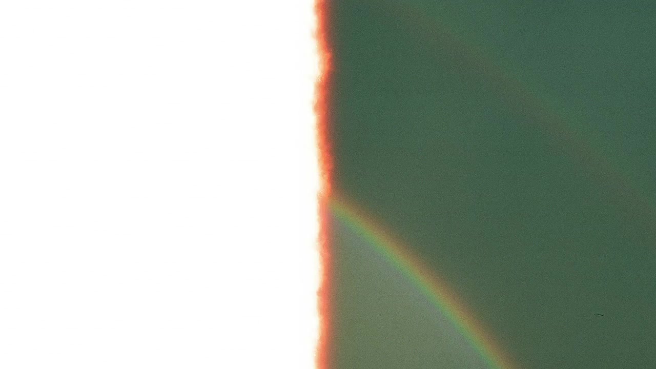 Abstract Vintage Film Grain and Light Leak Overlay with Warm Colors