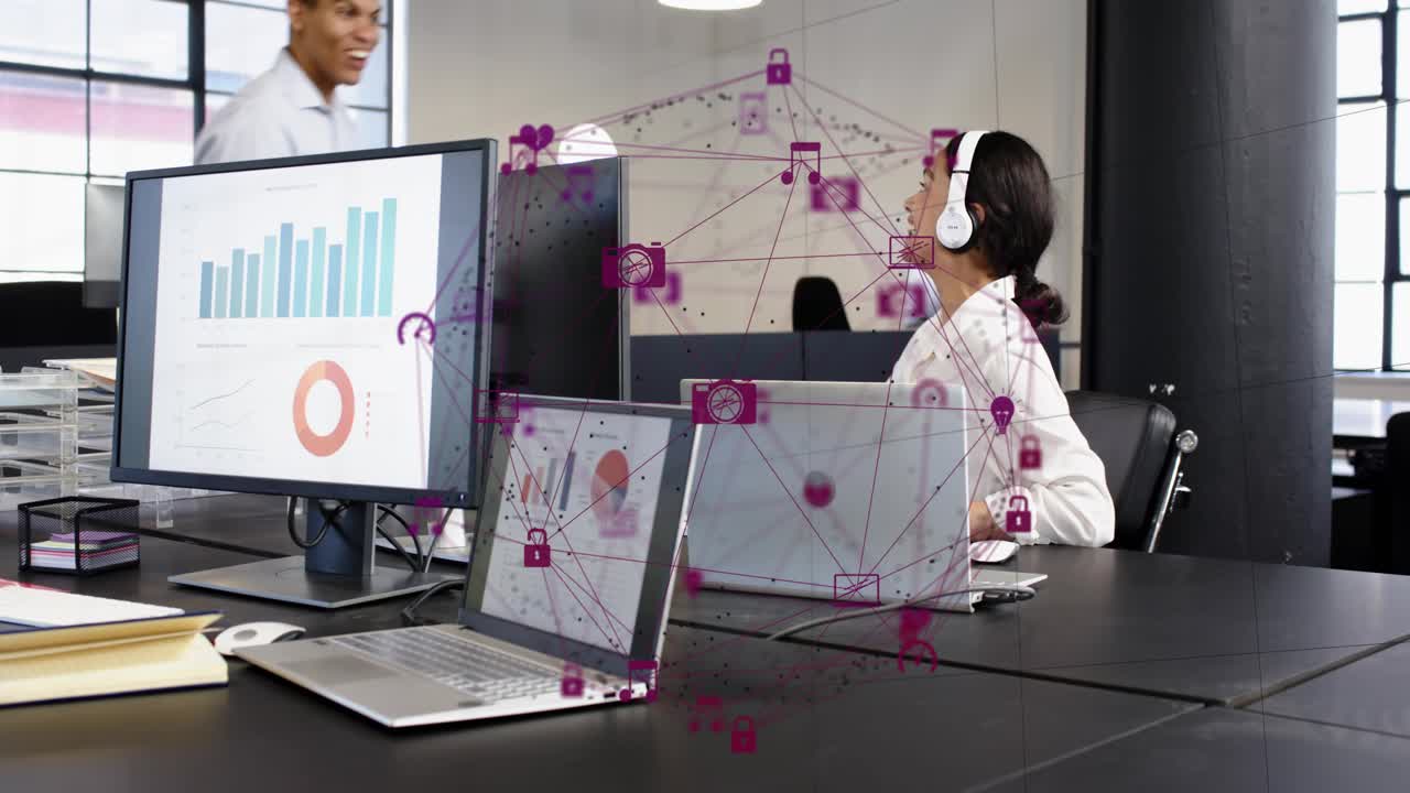 Woman clapping as man pointing monitor at business desk, icons on charts, shaking hands after win