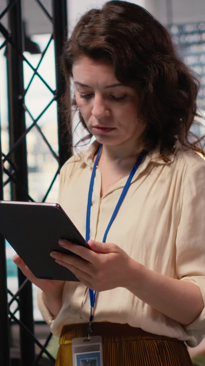 Vertical Video Empowered CEO examining monthly reports data for efficiency