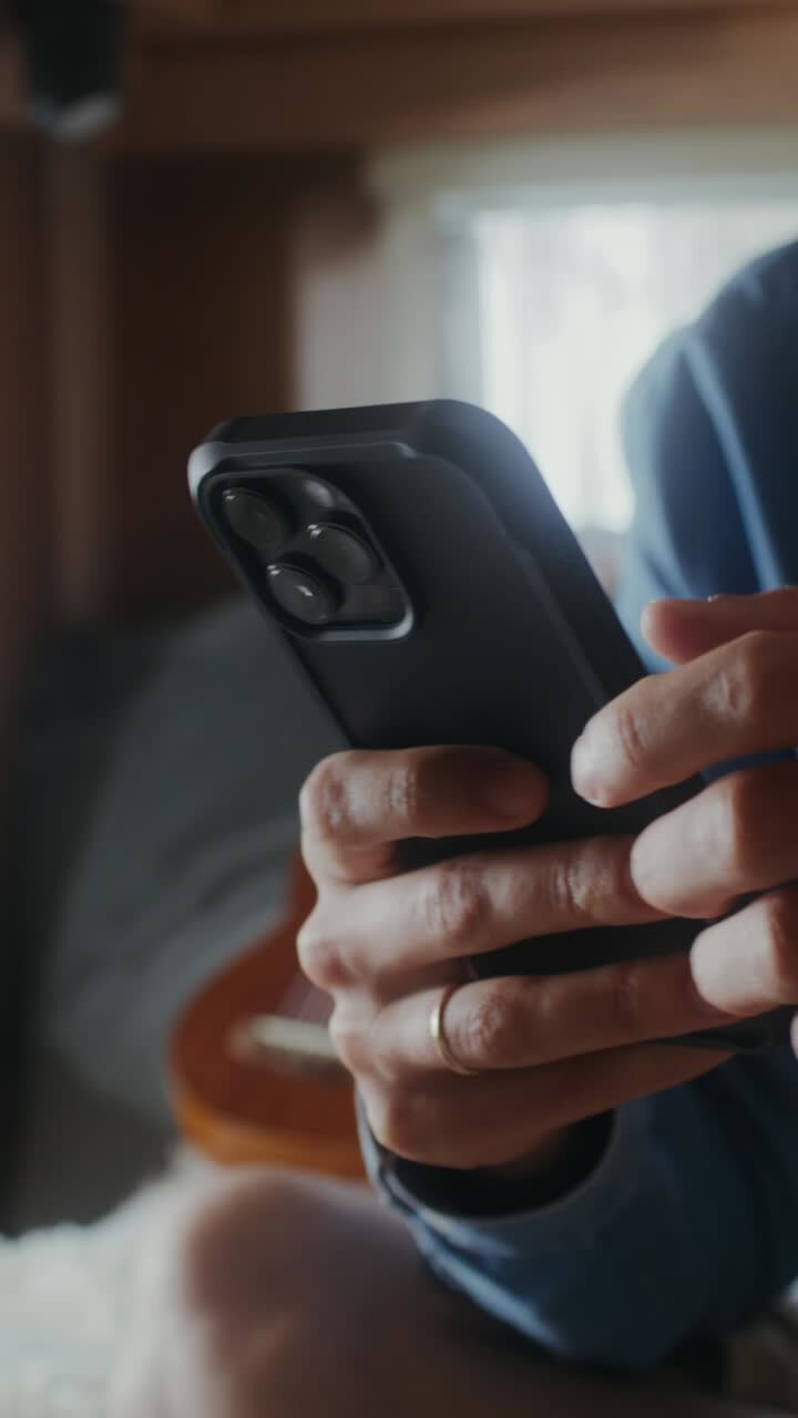 Person holding a black smartphone