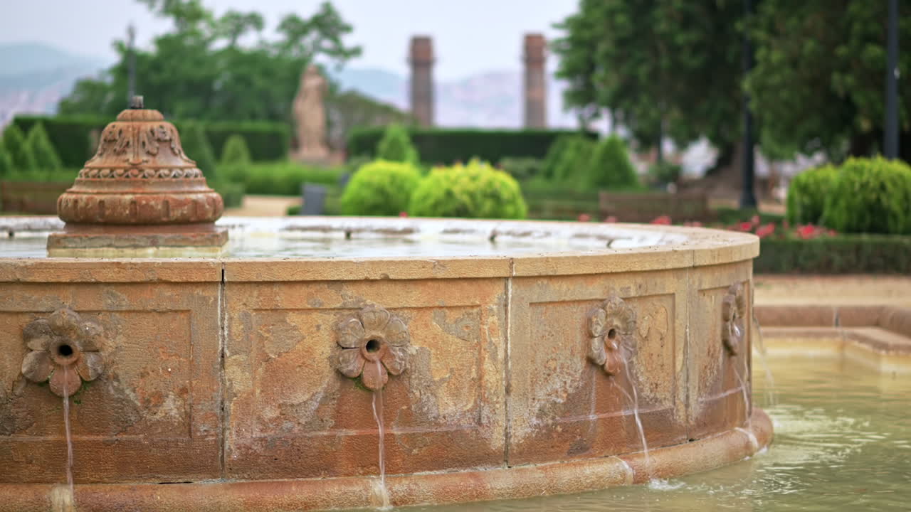 Fountain in the square of the Estadi Olimpic Lluis Companys stadium in Barcelona, Spain