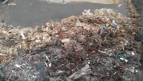 rising aerial shot of discarded landfill waste at a disposal dump, environmental destruction issue