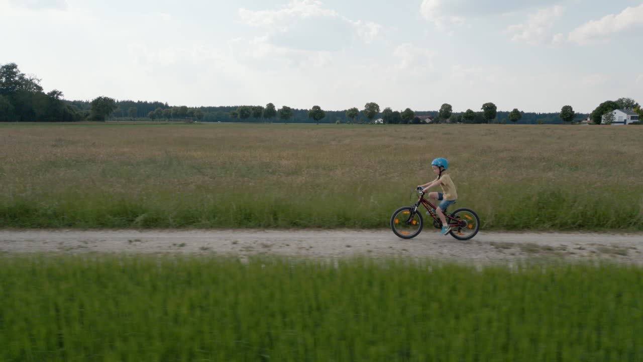 Captivating Drone Footage: Child&rsquo;s Bicycle Ride in the Picturesque German Countryside