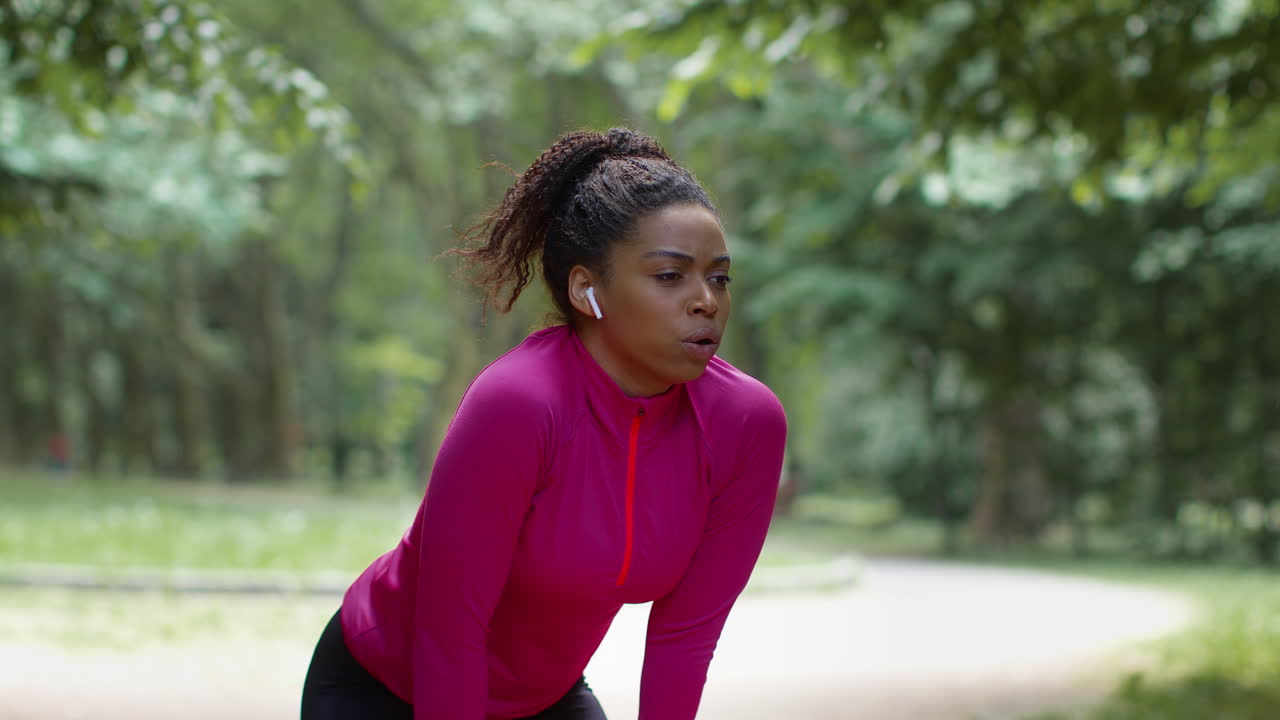 Woman Taking a Break After Exercising in the Park